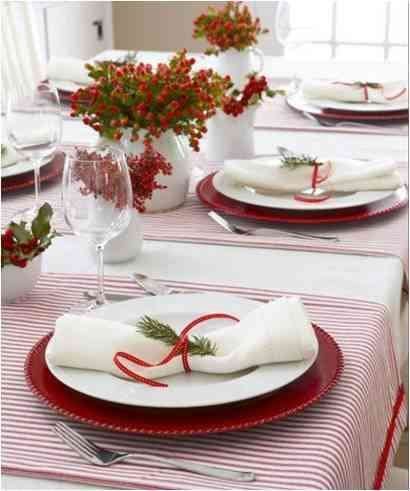 Table setting for Christmas with minimalistic red elements