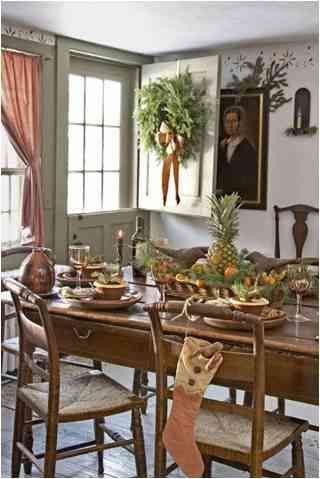 Christmas table setting with citrus elements and exotic fruits