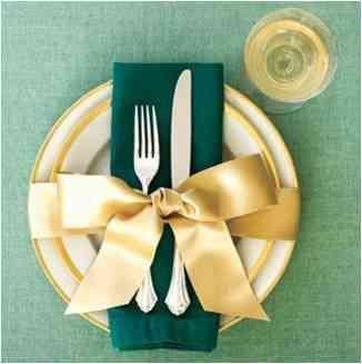 Green Christmas table setting with gold accents