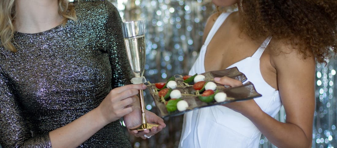 Wine plates that hold a glass and a champagne flute for an NYE party.