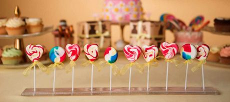 Baby Shower Candy buffet with an elegant lollipop stand by Anna Vasily with colourful heart shaped lollipops.