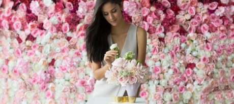Pastel pink plates by annaVasily - A woman arranging a bouquet in a beautiful pink vase